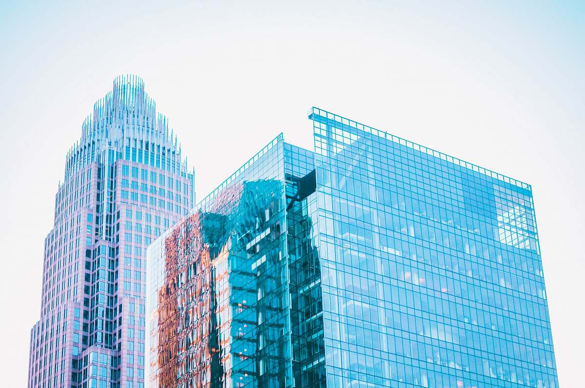 office building high-rise concrete building during daytime city